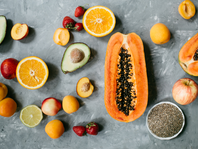 Healthy food clean eating selection: fruit, berries, Chia seeds, superfood on gray concrete background.Top view, flat lay. High quality photo